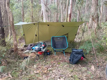 Tarp set up like an a-frame with one side open
